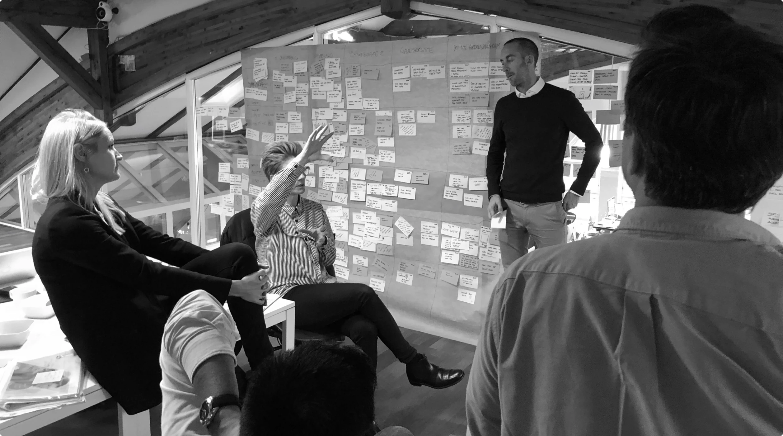 The team working through the member journeys on the wall